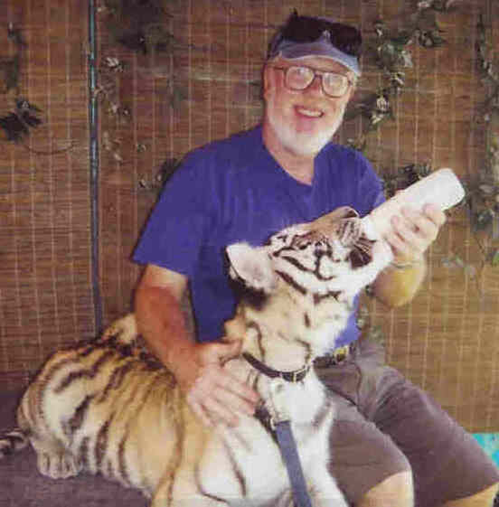 Doug feeding a Royal Bengal Tiger cub at 2003 Western Idaho Fair